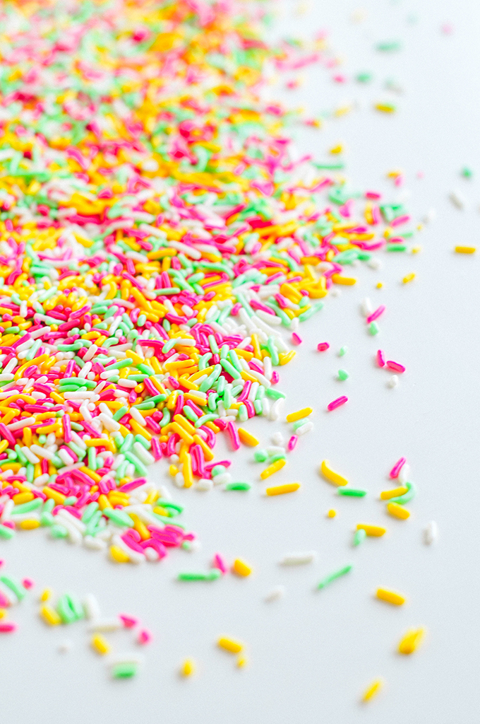 Birthday concept. Colorful sprinkles and candies on bright pink background,  top view Stock Photo - Alamy