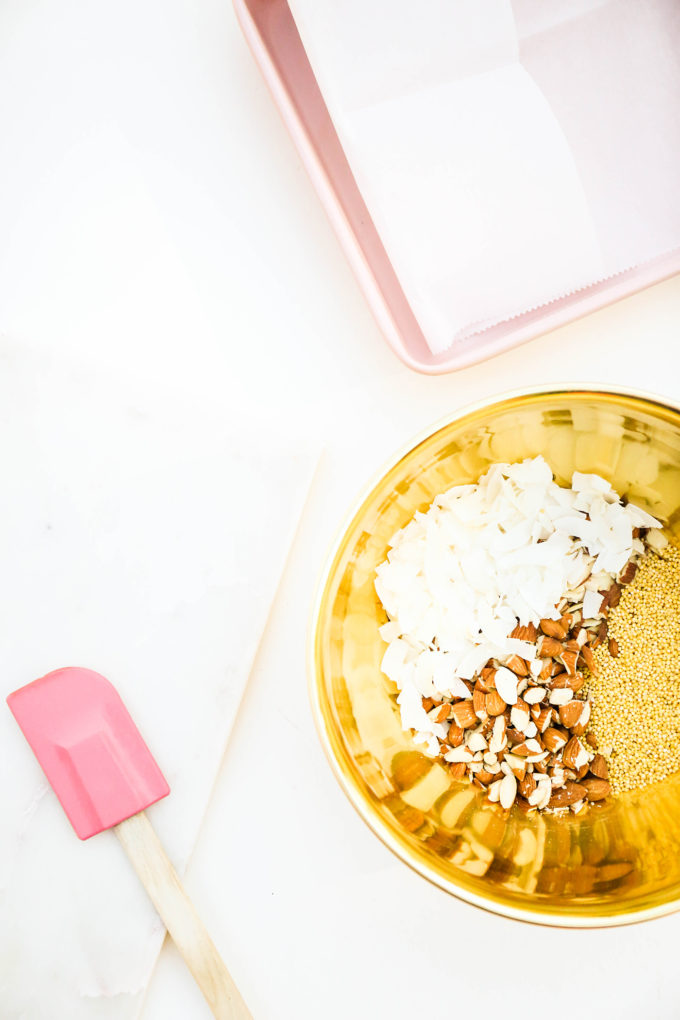 granola bar ingredients in gold mixing bowl 