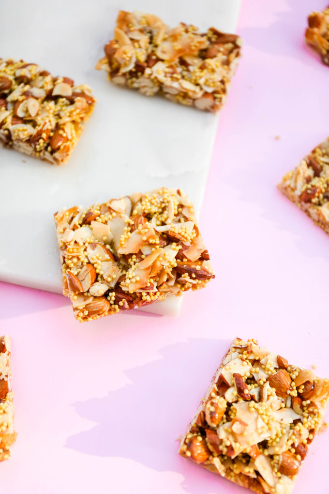homemade granola bars on pink and marble slab 