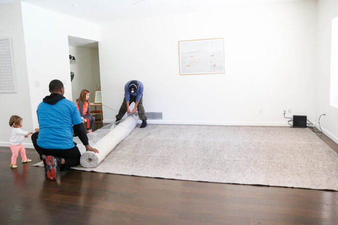 furniture delivery rolling out rug 