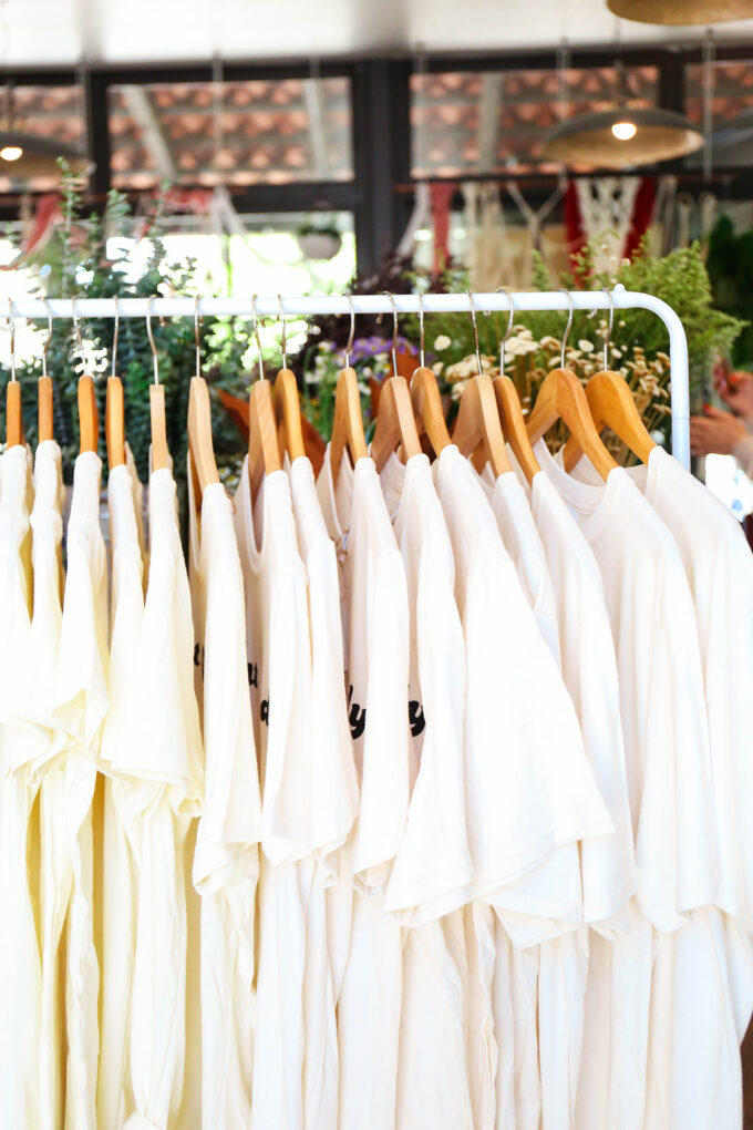 tee shirts on clothing rack 