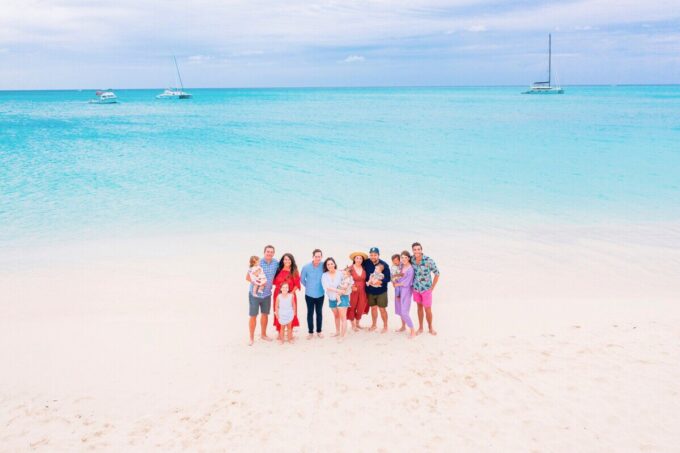 group smiling on beach 