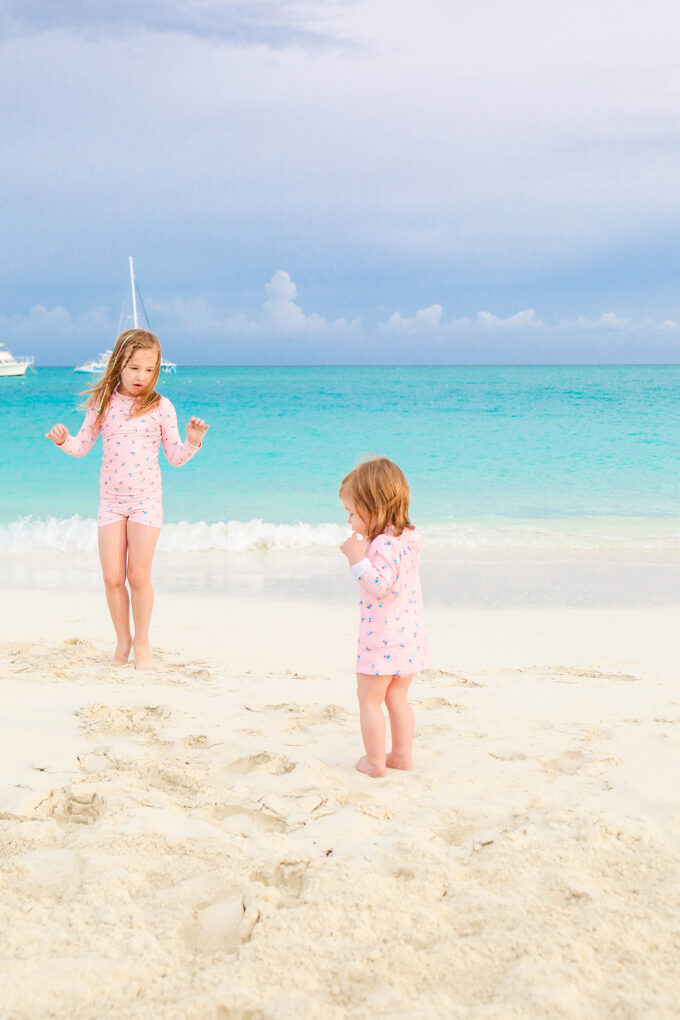 girls playing on beach 