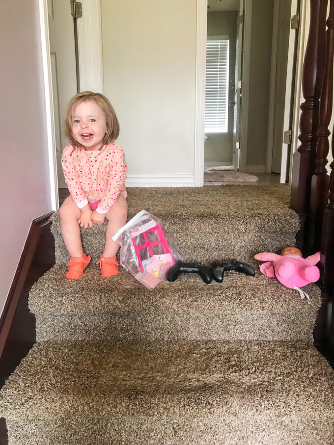 baby happy about toy organization