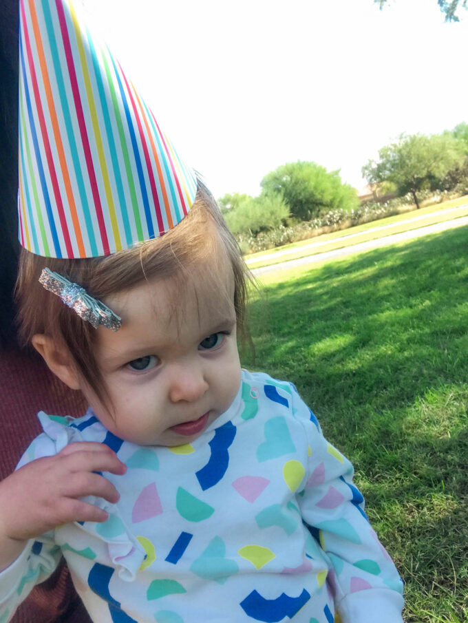 baby wearing a party hat 