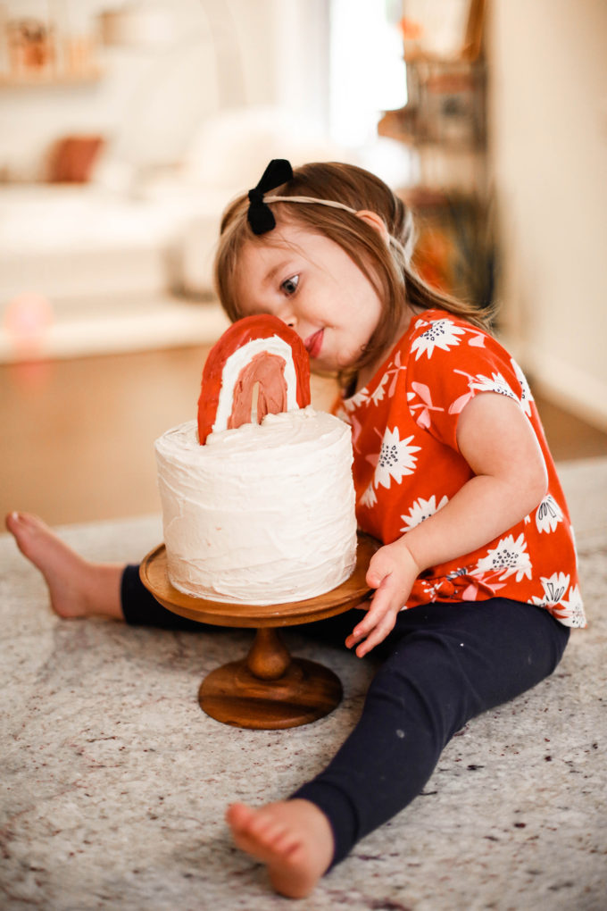 little girl eating birthday cake 