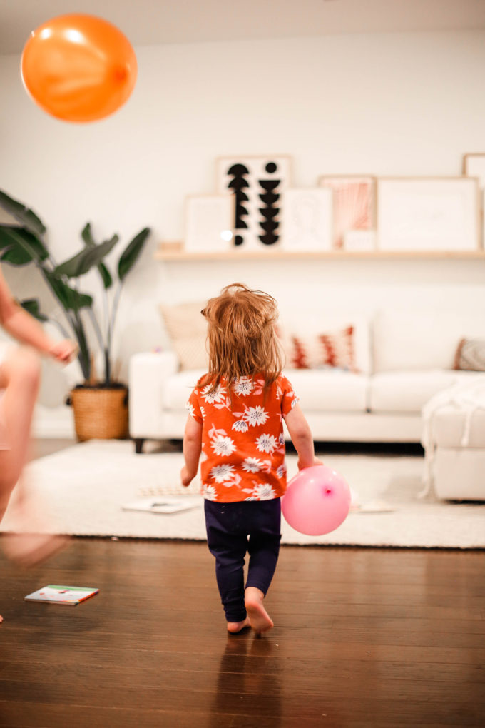 little girl walking away from camera