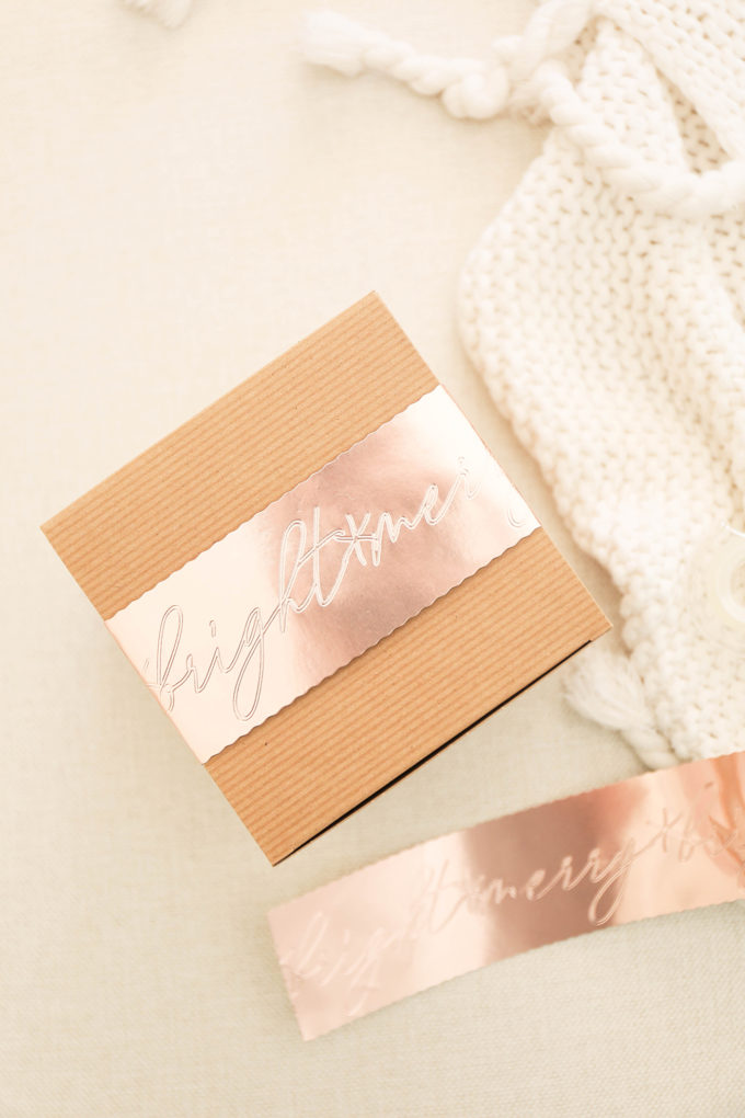 attach gift sleeve with tape to brown box
