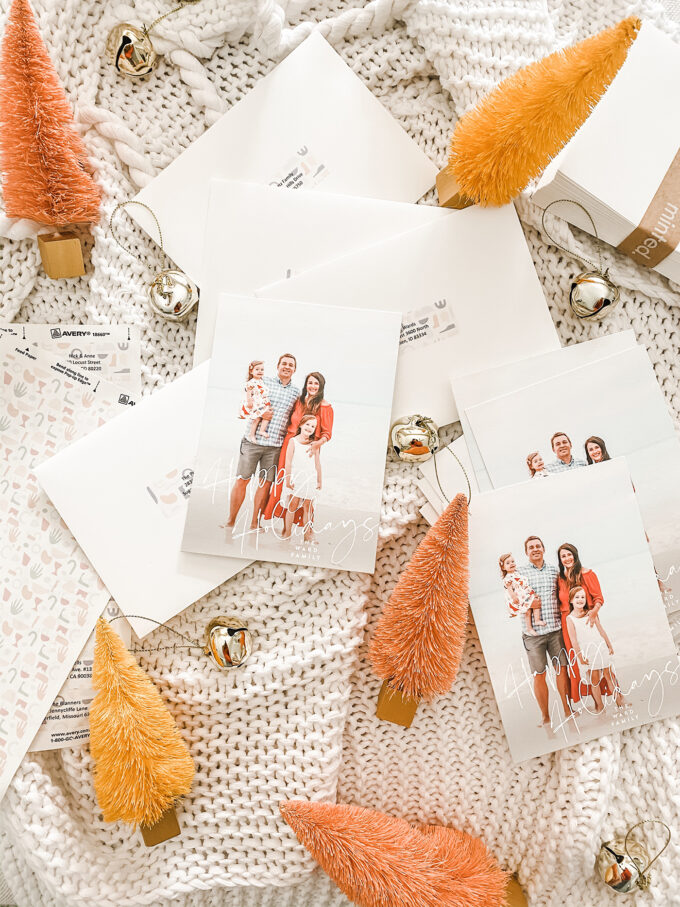 holiday cards scattered with bells and sisal trees 