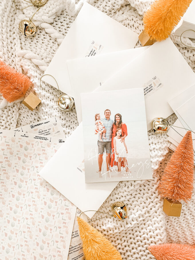 holiday mailing cards scattered with bells and sisal trees 