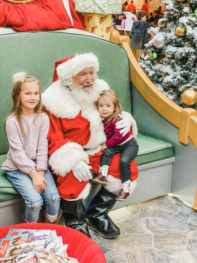 little girls sitting with Santa