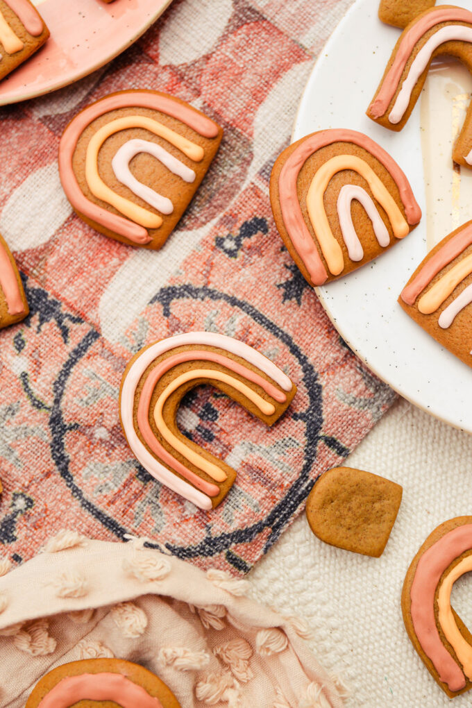 closeup of Boho Rainbow Gingerbread Cookies scattered one fabric 