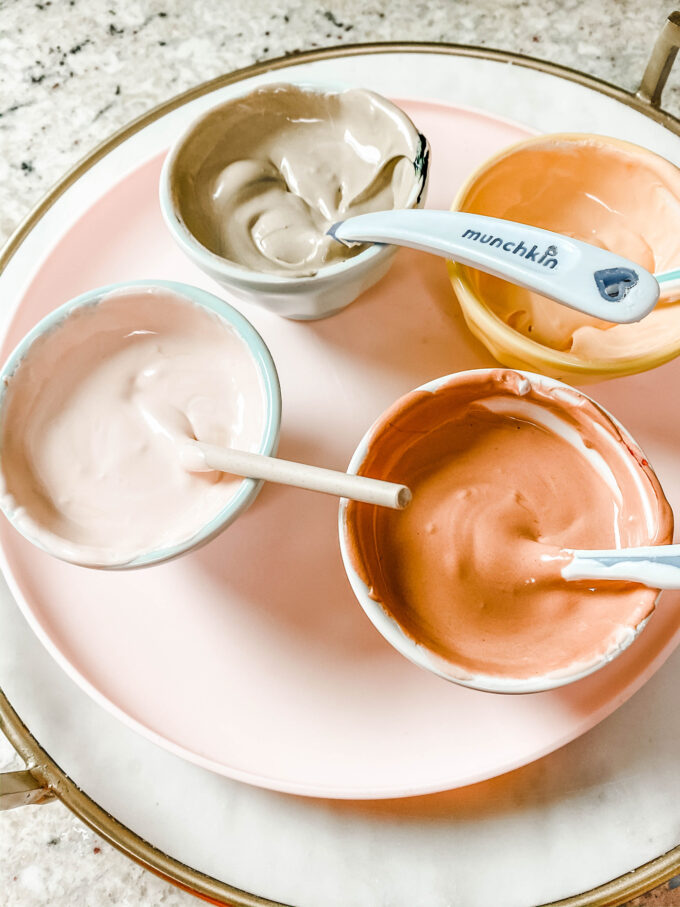 mini bowls of tinted royal icing 