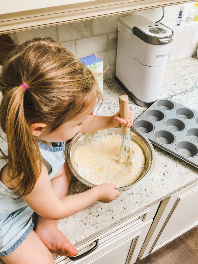 Funfetti Cupcake Cones - little girl stirring batter