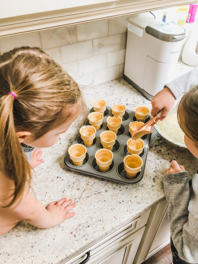 Funfetti Cupcake Cones - little girl filling cones with batter