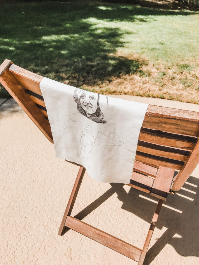printed fabric laying outside on chair to dry 