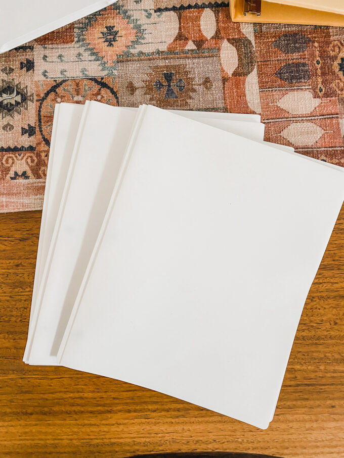 white folders on table 